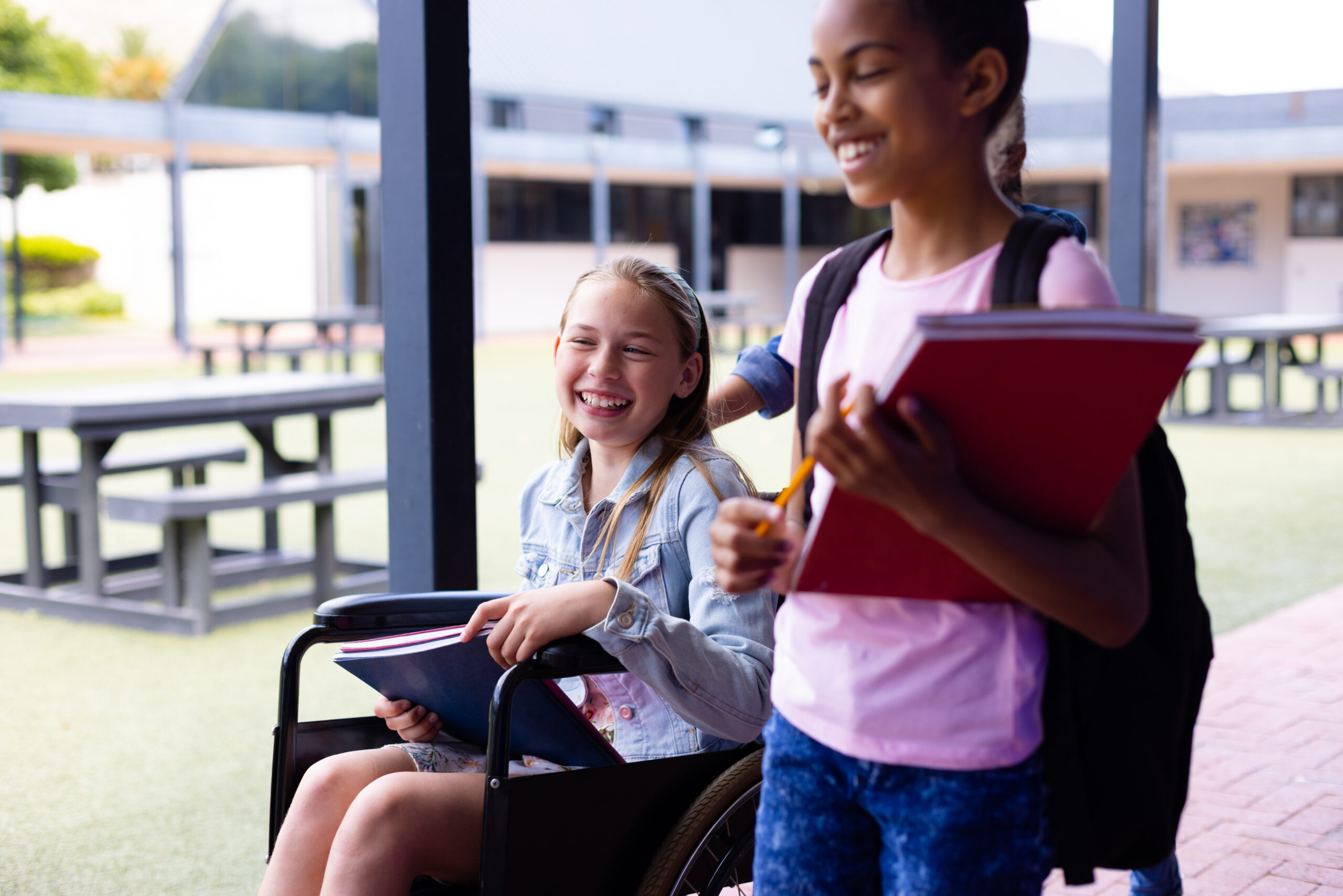 High school students walking and talking from behind.